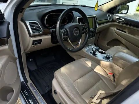 Jeep Grand Cherokee front seats and floor after an interior detail